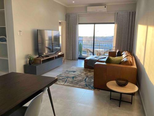 Gaborone Apartment | Discover Urban Awe Apartment: Sarona City with Pool Access