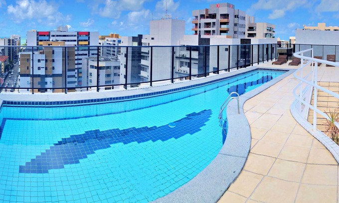 Ponta Verde Apartment | Stunning Amethyst 7 Apartment with Rooftop Pool & Views