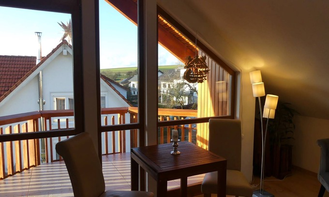 Bad Urach Apartment | Cozy Vacation Room with Balcony and Ocean View