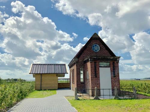 Oostwold Gem Oldambt House | Oceanfront Retreat: Vakantiewoning Het Gemaal Awaits You