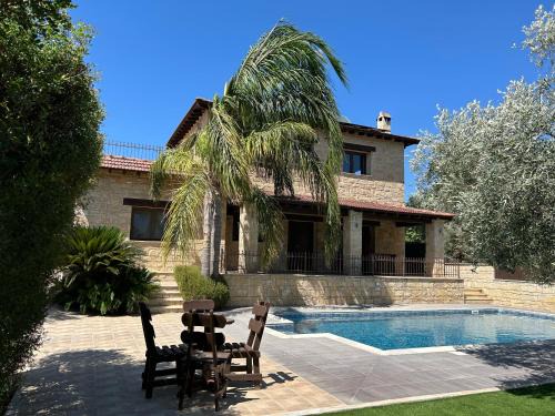 Miliou Villa | Elegant Valencia Grove Villa with Oceanfront Views