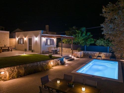 Kontos House | Exceptional Van Louis Place: Oceanfront Retreat with Pool
