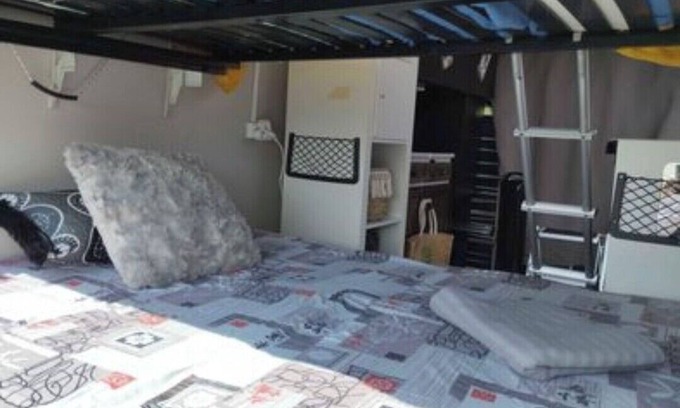 Millenaire House | Van set up in a PUBLIC parking lot that's good for repairs