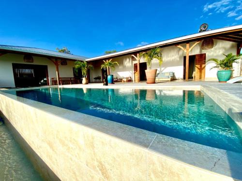Grand-Bourg House | Cozy Oceanfront Escape at Vanille et Vahiné - 8.2/10 Rated