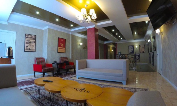 Heniches'k Hotel | Discover Vegas: Family-Friendly Stay with Pool and Breakfast