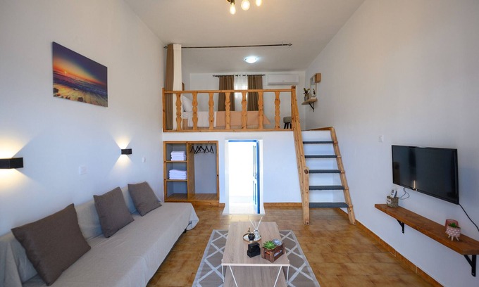 Panormos Apartment | Verano V1: Cozy Apartment Steps from the Beach with Pool