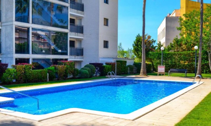 Sant Carles de la Rapita Apartment | Oceanfront Escape at Vila del Far with Spa & Pool Access