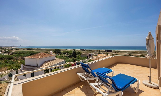 Meia Praia Apartment | Experience Vila Palmeira: Oceanfront Escape with Spa & Pool