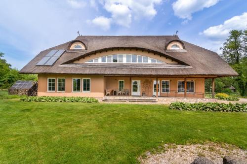 Panevezys county House | Beachfront Retreat at Vila Sanzila with Ocean Views