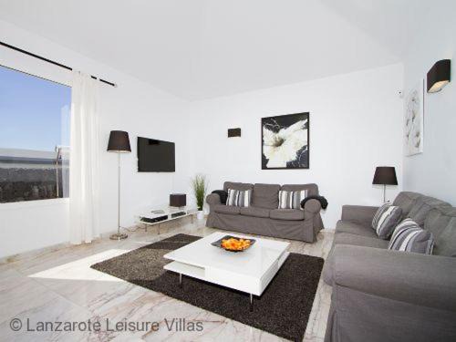 Puerto del Carmen Villa | Villa Benedicte: Oceanfront Escape with Heated Pool
