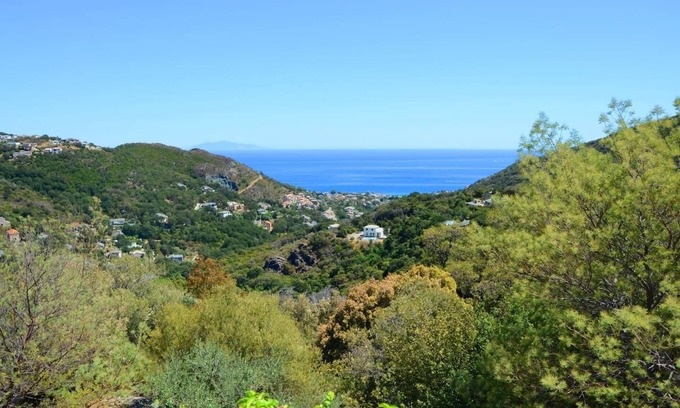 Figarella House | Scenic Villa Nestled Between Sea and Majestic Mountains