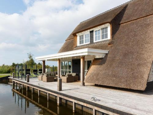 Delfstrahuizen Villa | Inviting Villa with Sauna and Scenic Views for Families