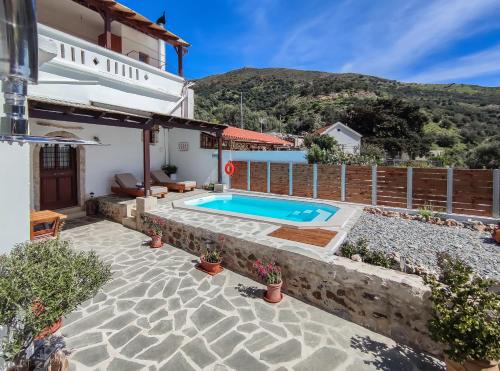 Rodakino Villa | Villa Cosmakis: Oceanfront Bliss with Pool & Hot Tub