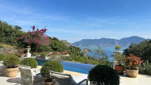 Armacao House | Experience Villa das Graças: 4-Star Oceanfront Retreat