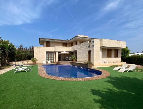 Marratxi Villa | Elegant Villa with Pool, Oceanfront Views & Hot Tub