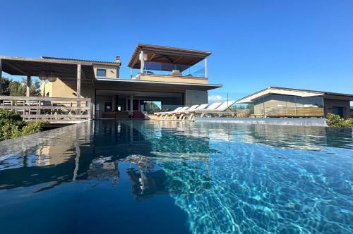 Pianotolli-Caldarello Villa | Oceanfront Villa with Infinity Pool & 4-Star Comfort