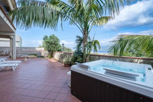 Faro Superiore Villa | Experience Villa Emy: 4-Star Stay with Hot Tub & Pet Friendly