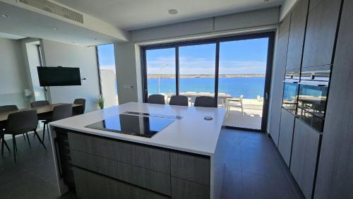 Mellieha Villa | Villa Enchante: Oceanfront Retreat with Pool & Pet Welcome