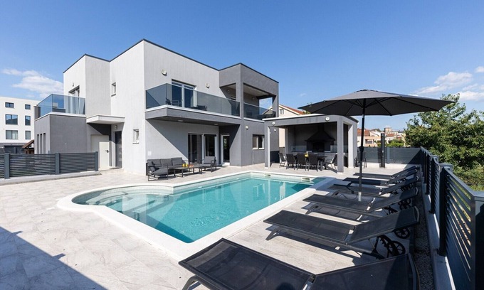 Dicmo Villa | Villa Gabriel: Relax by the Heated Pool and Enjoy Spa Amenities