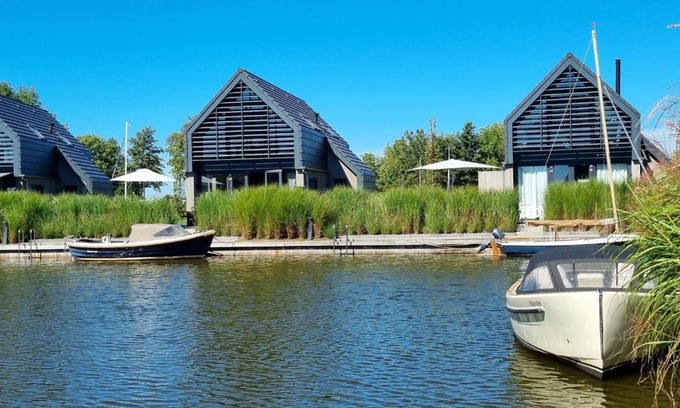 Balk House | Elegant Water Villa Retreat with Jetty for Family Getaways