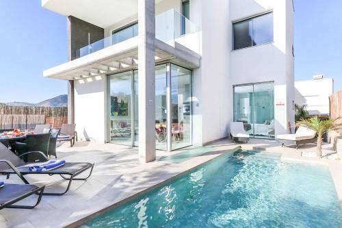 Diputacion de Rincon de San Gines Villa | Villa Las Dalias 1: Oceanfront Retreat with Pool Access