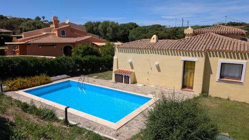 Punta De Su Turrione Villa | Serene Villa Liliana: Oceanfront Retreat with Pool Access