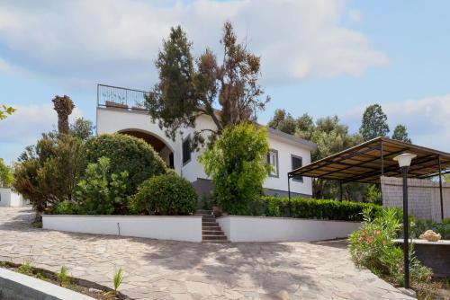 Sarroch House | Discover Villa Matteo: Poolside Retreat with Family Amenities