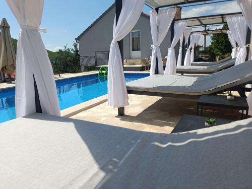 Trilj Villa | Villa Marija: Oceanfront Retreat with Heated Pool & Hot Tub