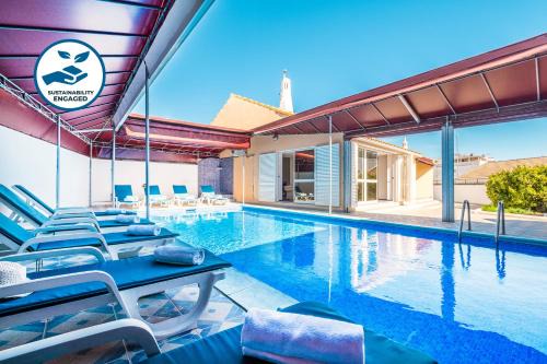 Areias de Sao Joao Villa | Villa Mogan: Oceanfront Retreat with Pool and Family Fun