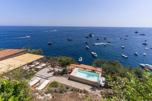 Marina del Cantone Villa | New Villa with Jacuzzi, Steps from the Beach & Ocean View