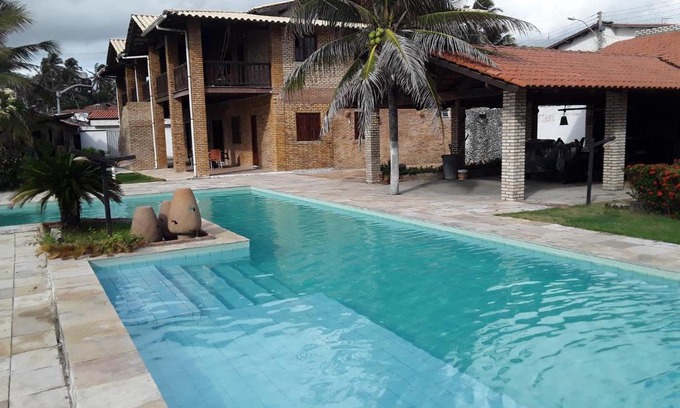 Prainha Apartment | Oceanfront Villa Orazio Prainha: Pet Friendly & Poolside Bliss
