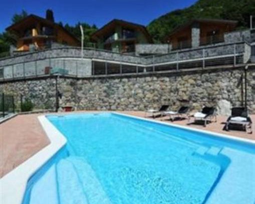 Regoledo Villa | Experience Villa Orchidea: Poolside Oasis with Ocean View