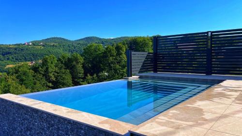 Visoko House | Seaside Retreat: Holiday Home Ajla with Pool & Ocean View