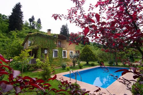 Yomra Villa | Experience Villa River Village: Oceanfront Oasis with Pool