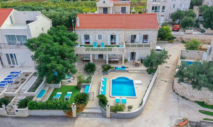 Lumbarda Villa | Villa Southern Beauty: 6-Bedroom Oasis with Pool & Jacuzzi