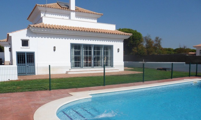 Nuevo Portil Ski Chalet | Spacious Villa with Pool for 16, Steps from the Sea
