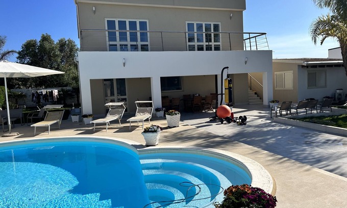 Fanusa Villa | Elegant Villa with Pool Steps from the Sea in Syracuse