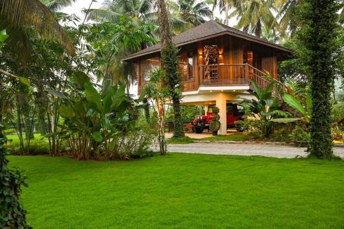 Pollachi Villa | Villa Woods & Palms: Oceanfront Escape with Pool Access