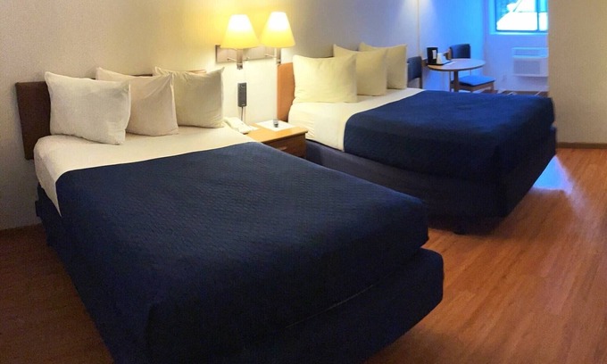 Two Rivers Hotel | Relaxing Village Inn on the Lake with Pool & Spa Access
