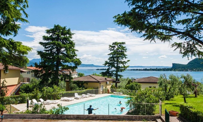 Villaggio Sanghen Apartment | Tranquil Villenpark Sanghen: Pool, Ocean & Lake Views