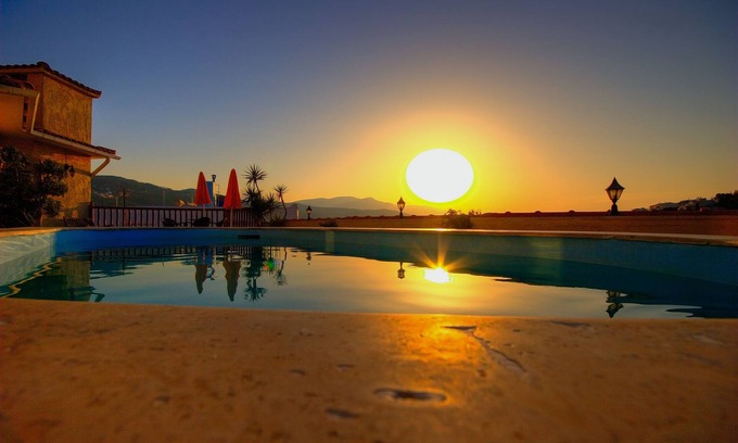 Vathi Hotel | Discover Virginia Hotel: Family-Friendly with Pool & Eco Perks