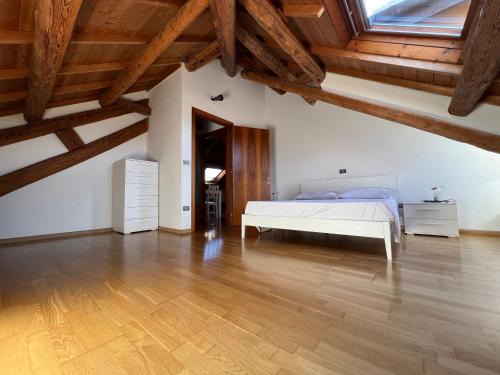 Visome Apartment | Elegant Visentin: Unique Wooden Attic with Family Amenities
