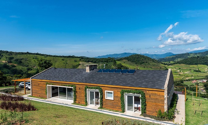 Campos do Jordao Cottage | Elegant Vista with 4 Suites, Heated Pool & Sauna Access