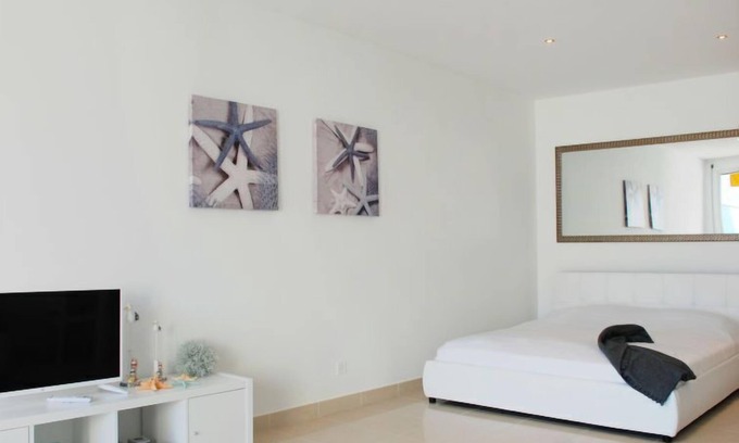 Locarno Apartment | Experience Vista Panorama: Pool, Spa & Lake Views Await