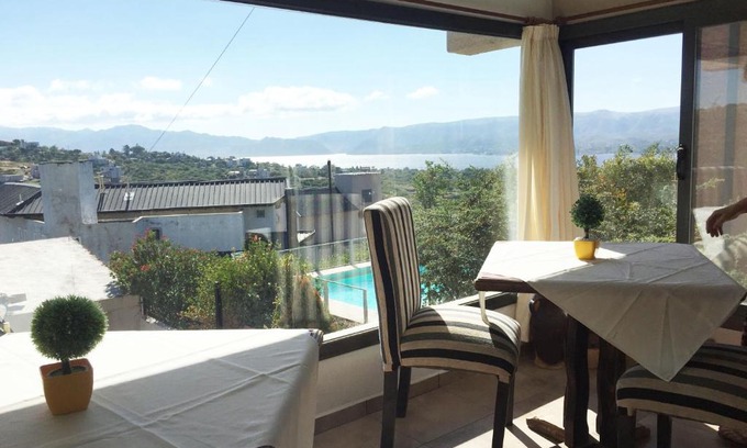 Villa Carlos Paz Hotel | Discover Vivaldi Suites: Family-Friendly with Pool & Breakfast
