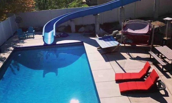 South Jordan Apartment | Family Retreat: Walkout Basement Apt with Hot Tub & Waterslide
