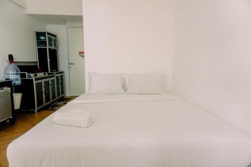 South Tangerang Apartment | Cozy Urban Studio Room in Serpong Apartment by Travelio
