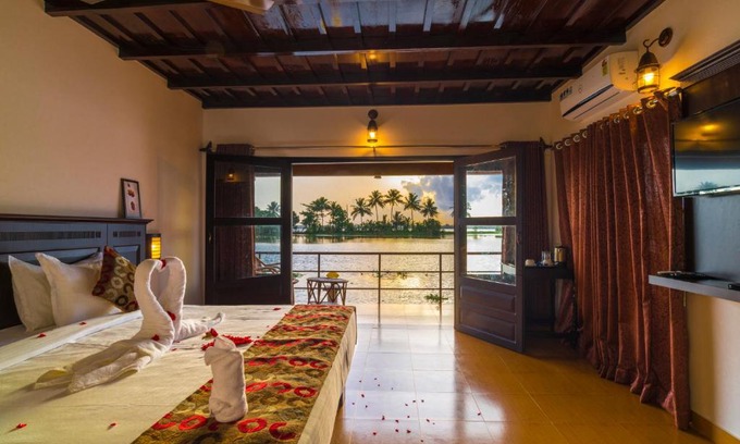 Nedumudy Resort | Cozy Warmth Lake Haven: Oceanfront Stay with Spa & Pool