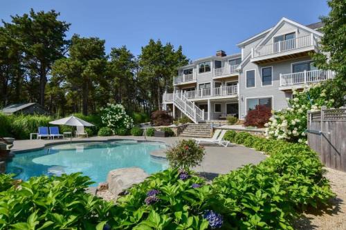 Wellfleet House | Relaxing Water Views with Heated Pool & Hot Tub Access