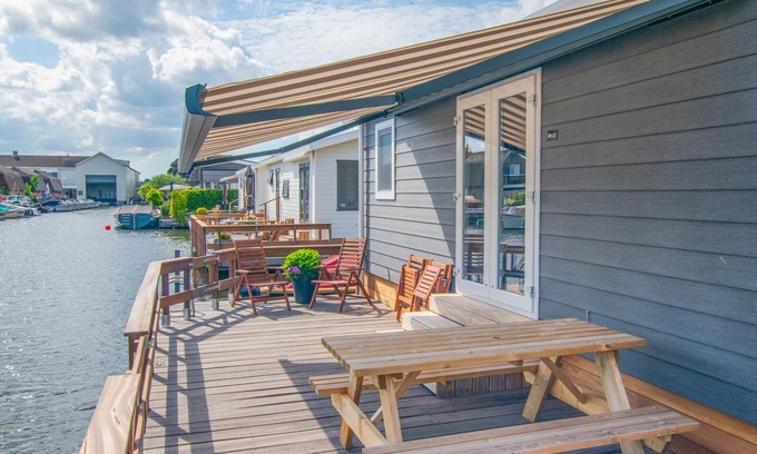 Municipality of Stichtse Vecht Ski Chalet | Idyllic Waterfront Chalet with Pool and Lake Views